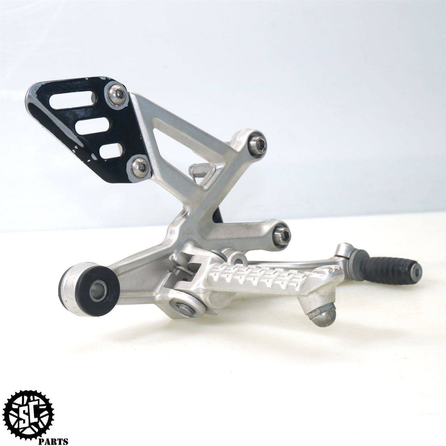 15-16 APRILIA TUONO V4 1100 RIGHT REARSET BRAKE PEDAL BRACKET A07