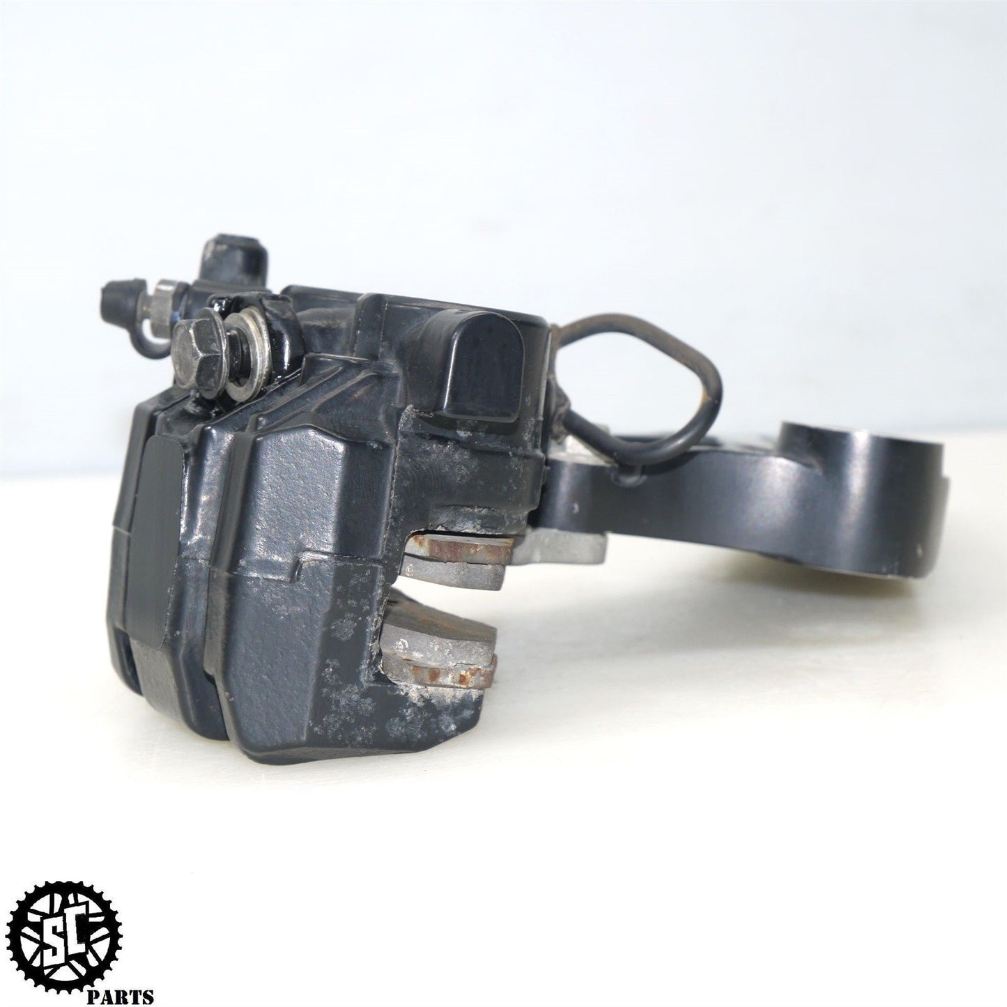 2012 KAWASAKI KLR 650 KL REAR BRAKE CALIPER BRACKET K50
