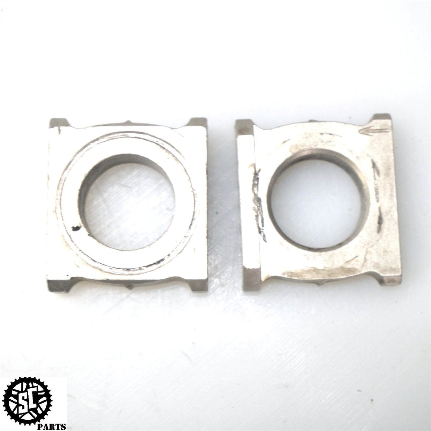 2006 2007 HONDA CBR1000RR SWINGARM AXLE CHAIN TENSIONER ADJUSTER BLOCKS H34