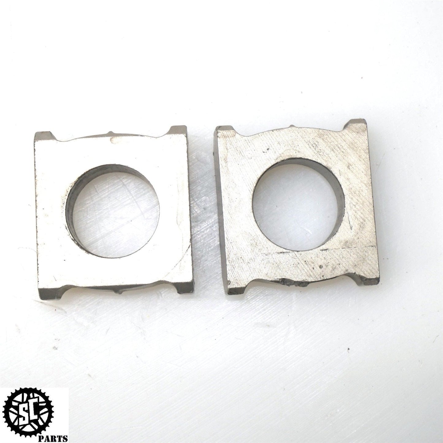 2006 2007 HONDA CBR1000RR SWINGARM AXLE CHAIN TENSIONER ADJUSTER BLOCKS H34