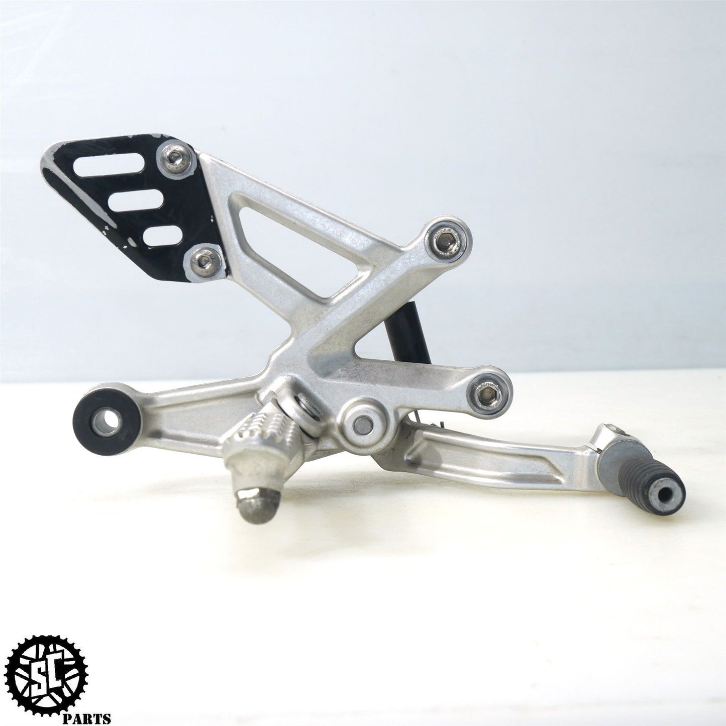 15-16 APRILIA TUONO V4 1100 RIGHT REARSET BRAKE PEDAL BRACKET A07