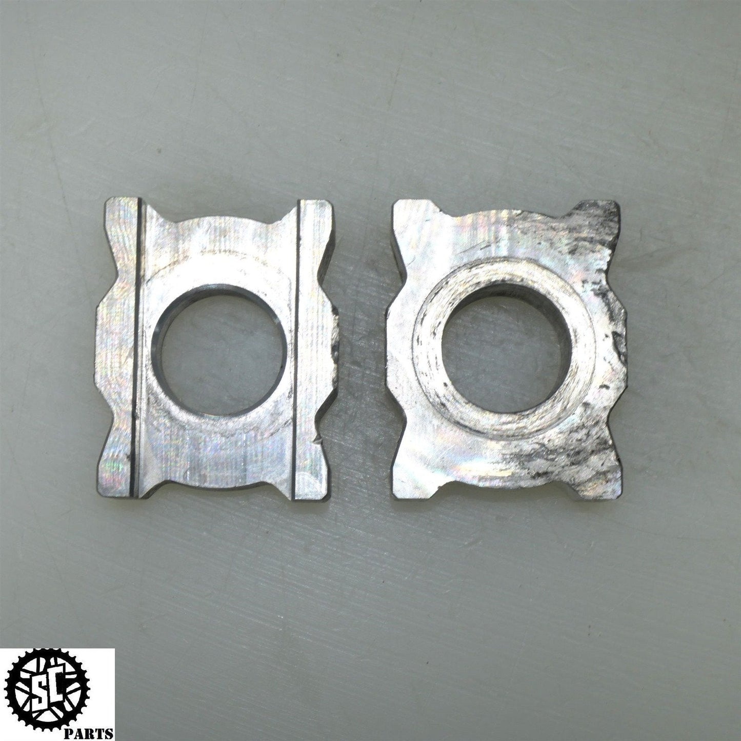 21-23 APRILIA RS660 REAR AXLE BLOCKS CHAIN ADJUSTER 2B006661 2B006662 A08