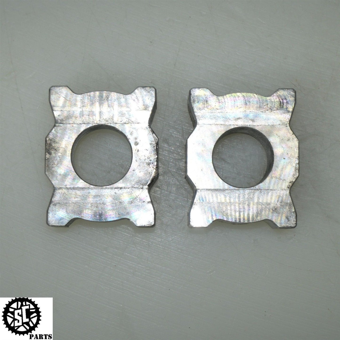 21-23 APRILIA RS660 REAR AXLE BLOCKS CHAIN ADJUSTER 2B006661 2B006662 A08