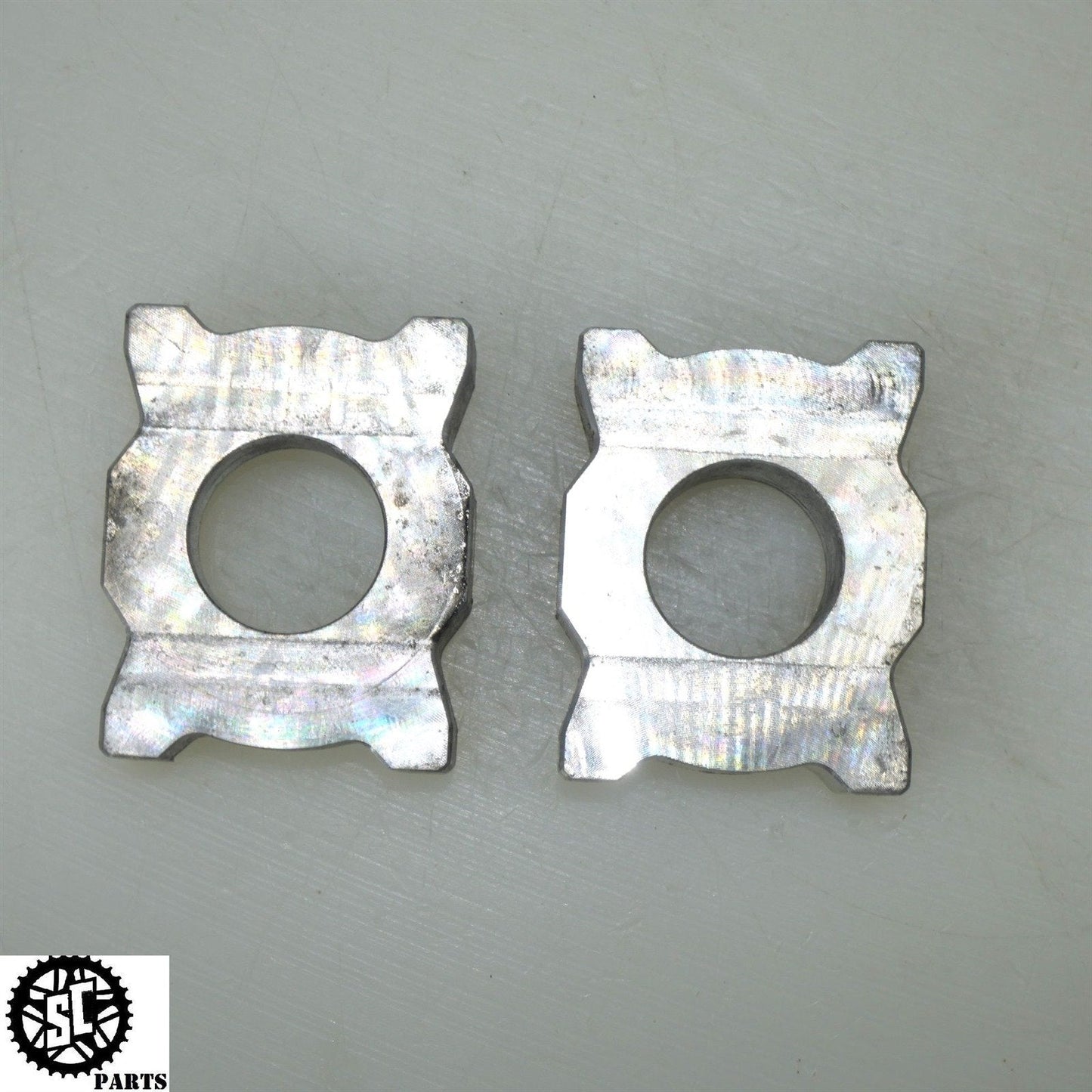 21-23 APRILIA RS660 REAR AXLE BLOCKS CHAIN ADJUSTER 2B006661 2B006662 A08