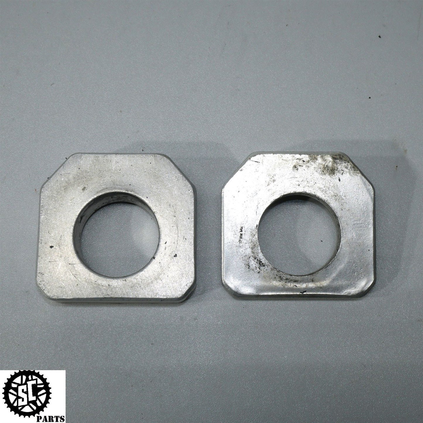 2007 SUZUKI GSXR 750 REAR AXLE BLOCKS CHAIN ADJUSTER S45