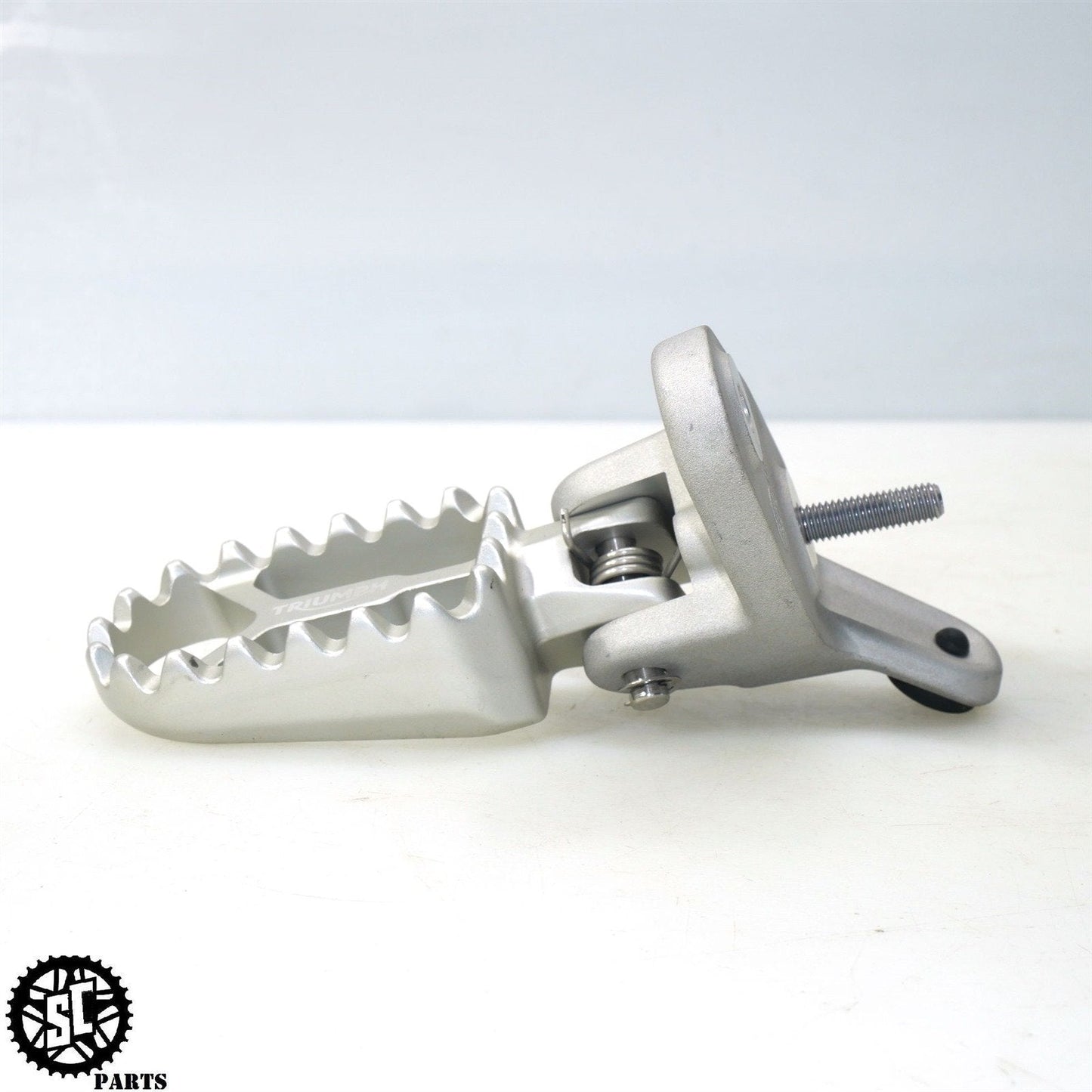 22-23 TRIUMPH TIGER 1200 LEFT FRONT FOOT PEG BRACKET T25