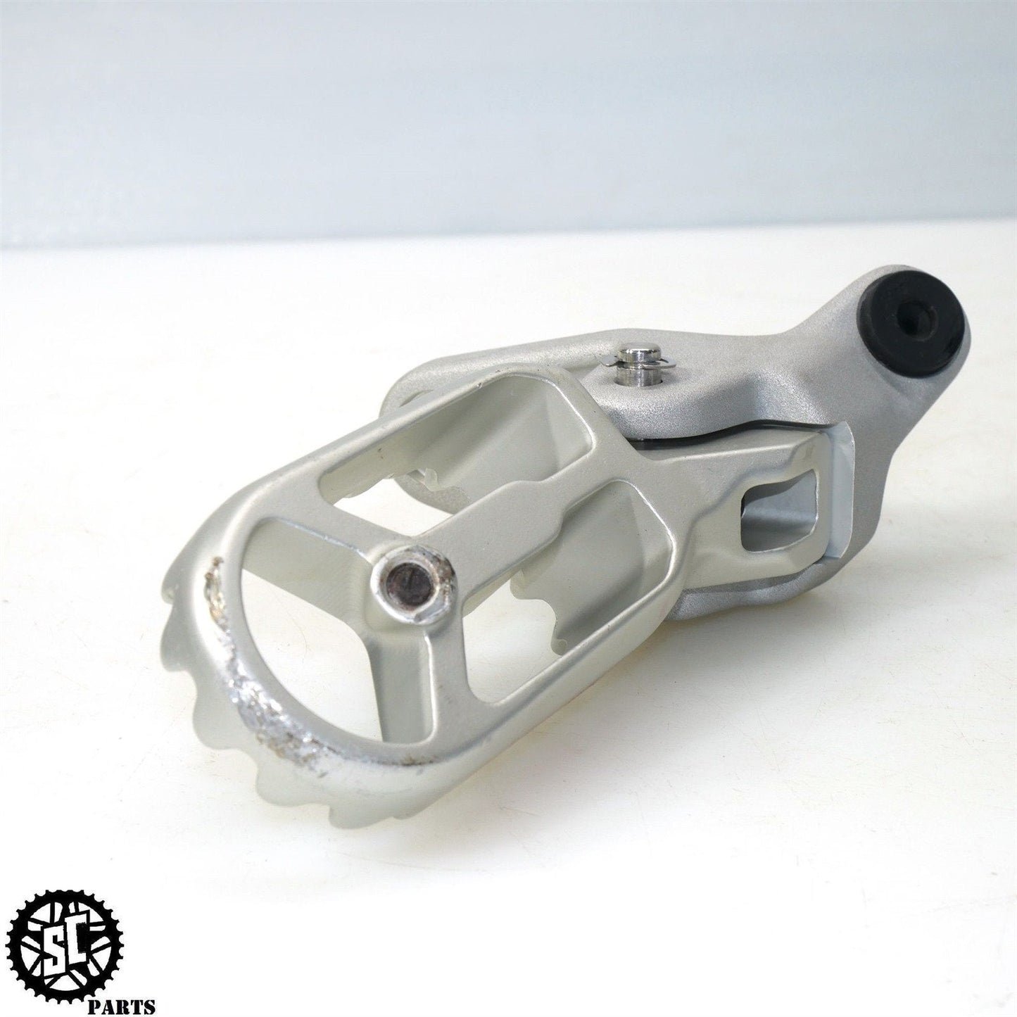 22-23 TRIUMPH TIGER 1200 LEFT FRONT FOOT PEG BRACKET T25